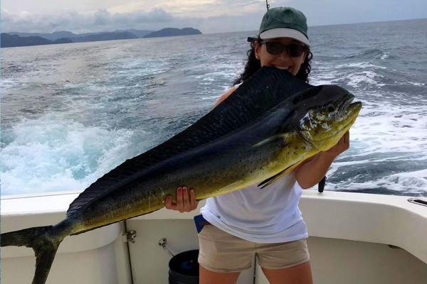 fishing girl with mahi mahi