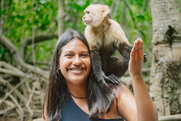 girl and monkey high five