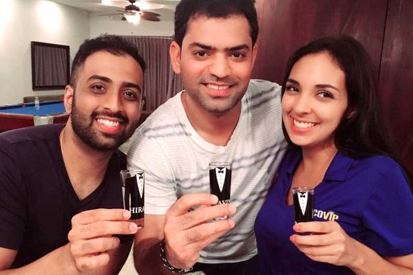 Two guests with JacoVIP Concierge holding shot glasses