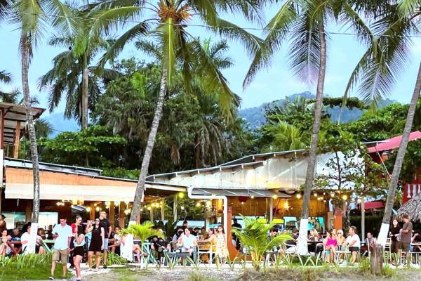 Sunset drinks at Koko Beach Bar in Jaco, Costa Rica with beachfront views