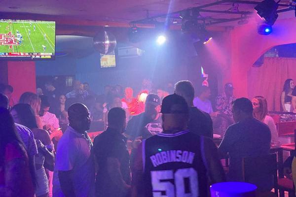 Reggaeton music and energetic dance floor at Orange Pub in Jaco Beach