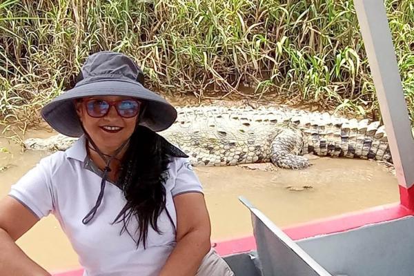 woman enjoying crocodile river tour in Costa Rica