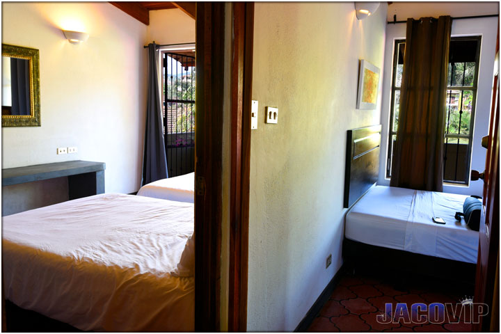 Halway angle view of bedroom number 2 and number 3