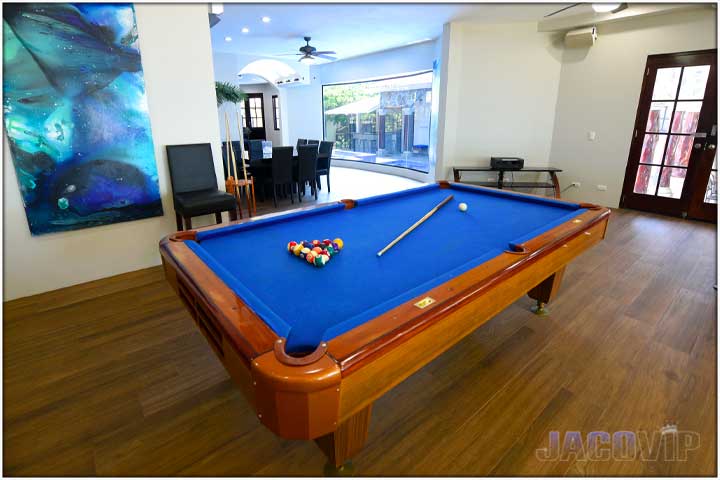 Blue artwork on the wall to match the pool table carpet