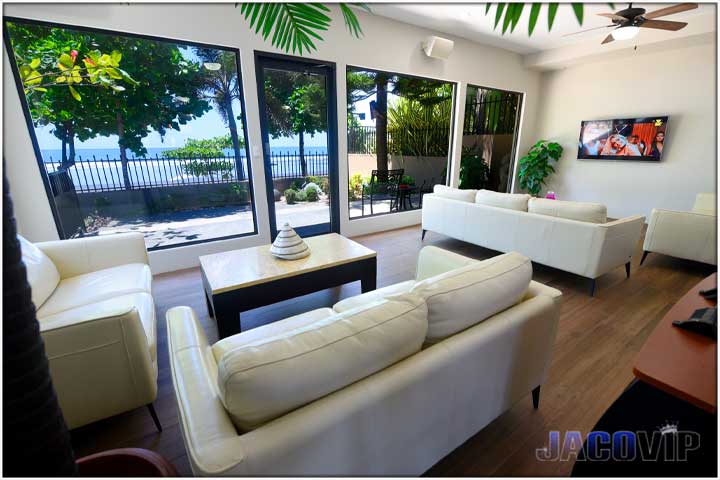 Beachfront living room with white sofas