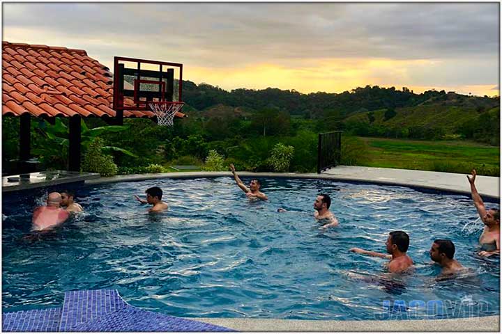 Guests playing swimming poll basketball