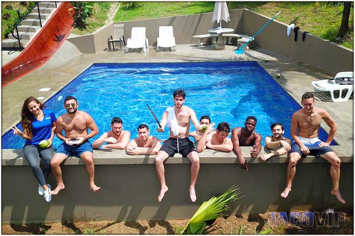 Bachelor party group with concierge at the water slide pool