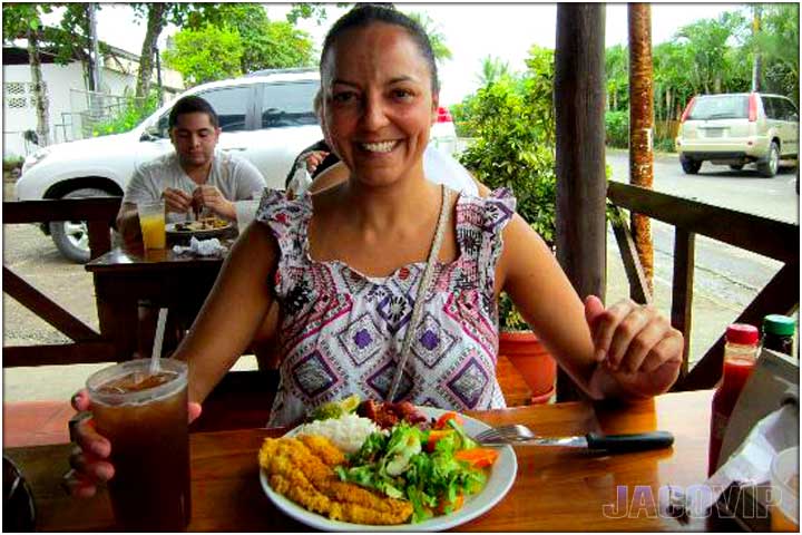 Woman eating casado at Soda Rustiko in Jaco