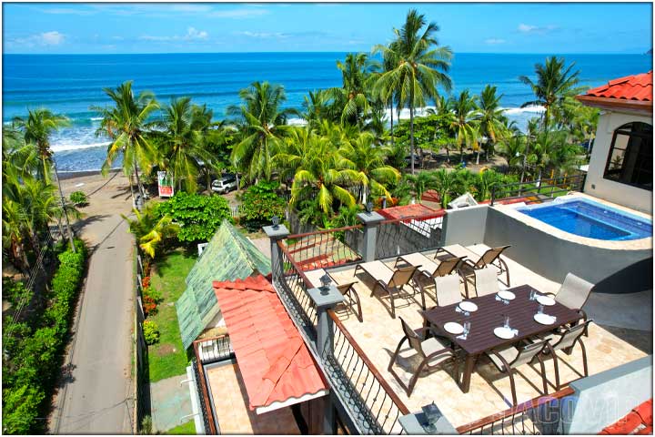 Aerial view of rooftop deck and street leading to jaco beach