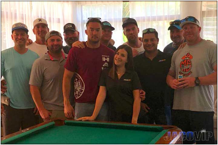 Bachelor party group with concierge at pool table
