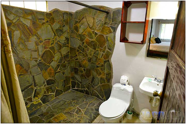Large bathroom with stone tiles