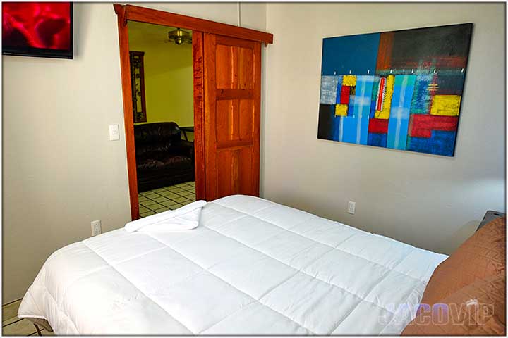 Colorful artwork on the bedroom wall