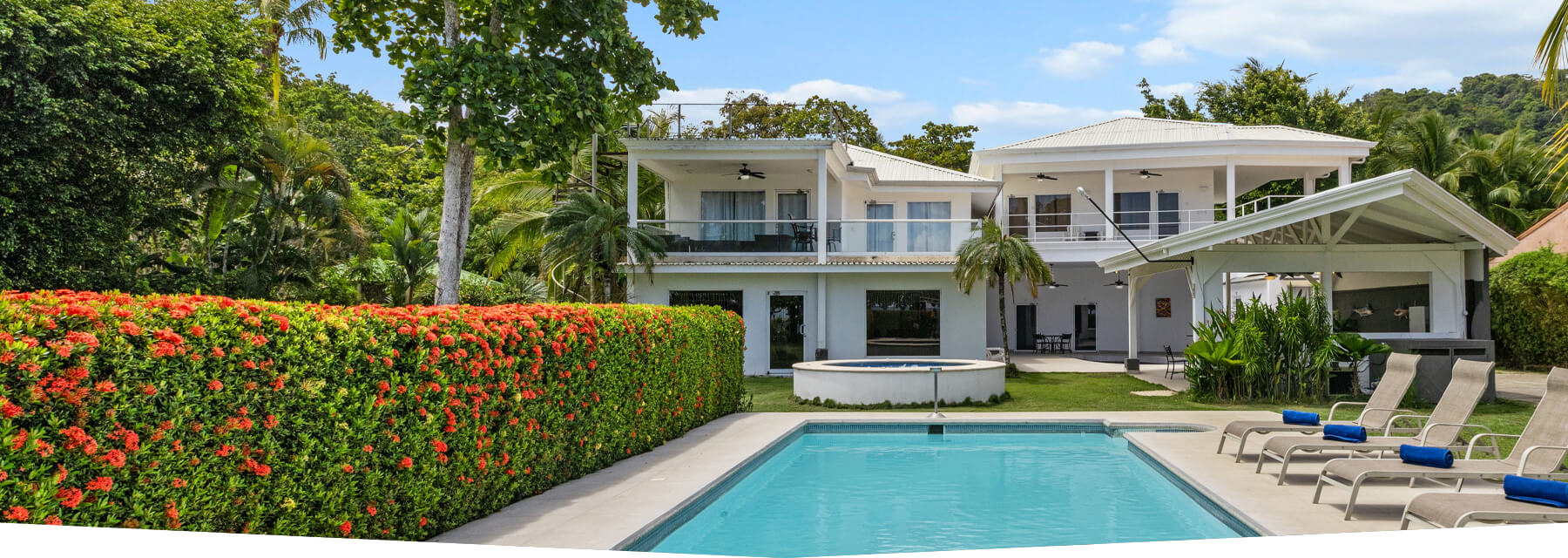 Casa Blanca vacation rental in Jaco Beach with private pool, jacuzzi, manicured garden, and spacious outdoor lounge area