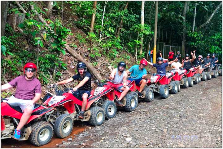 long line of ATVs at entrance to private waterfall in Costa Rica