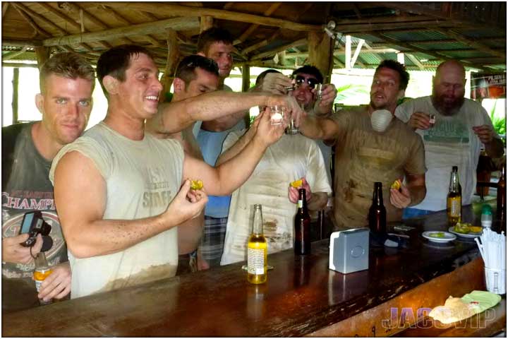 Group of guys having ashot at the bar