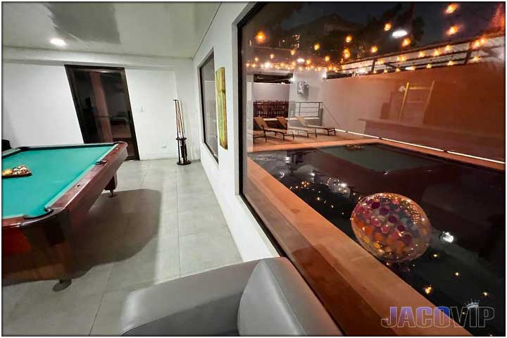 View of pool from inside the living room area