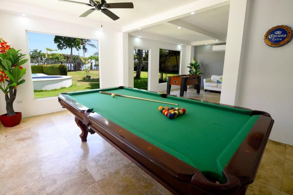 pool table with green carpet and pool balls racked up