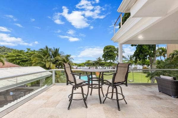 high top and bar stools on second floor balcony