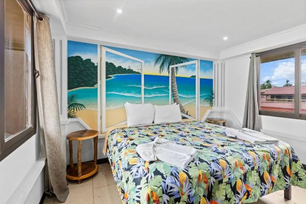 Tropical bedspread on bedroom 1