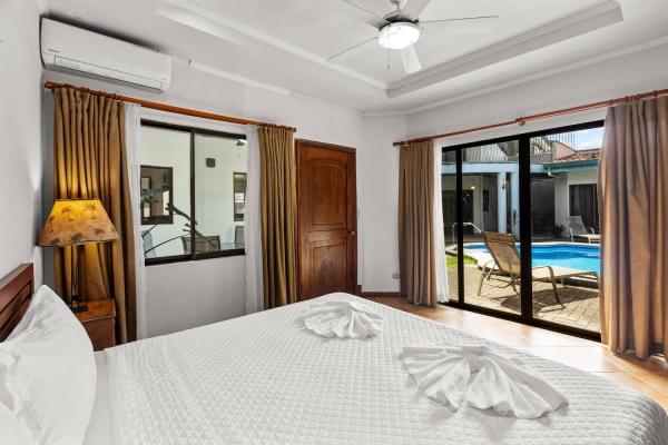 view of pool from bed in bedroom 4