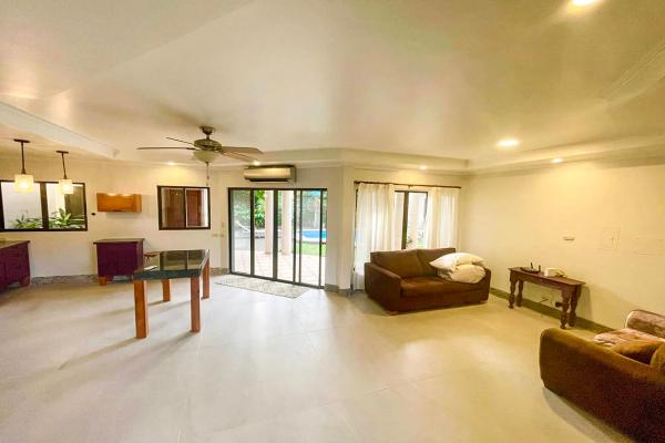 Secondary living room at Casa Cuatro, simple layout with pool view