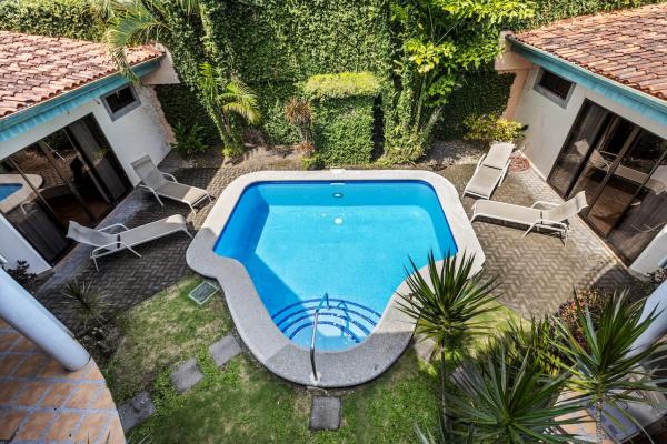 Second floor balcony at Casa Cuatro overlooking pool area in Jaco Costa Rica