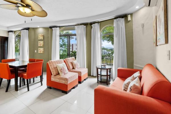 second floor living room with warm orange and red furniture