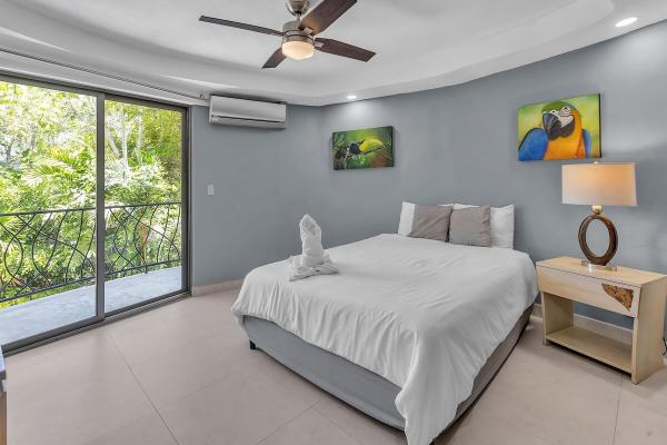 bedroom 2 with queen size bed at casa miro alta in jaco costa rica