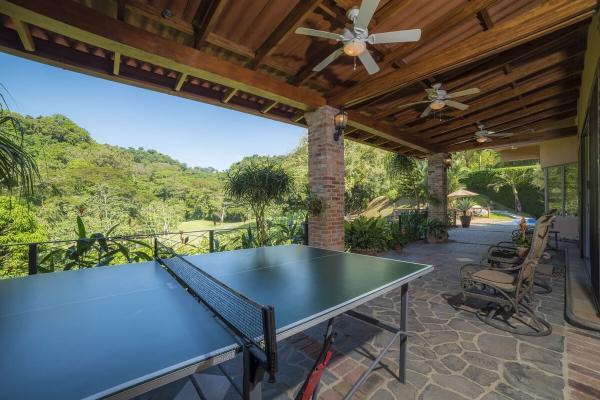 Ping pong table in an outdoor corridor at Casa Oasis