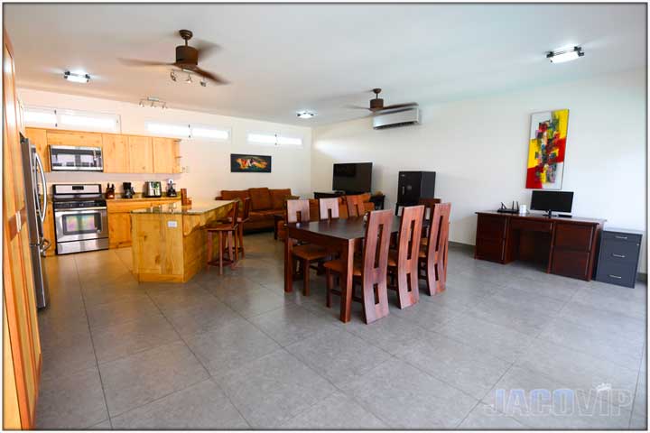 Wide angle view of living room and kitchen area
