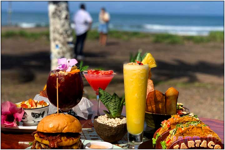 Food and drinks on table with ocean view