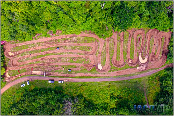 Direct over head drone photo of winding dirt race track