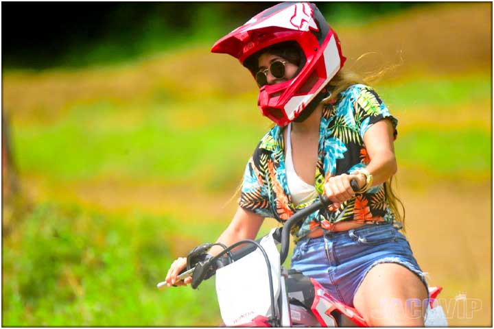 Close up of girl on mini dirt bike in Costa Rica