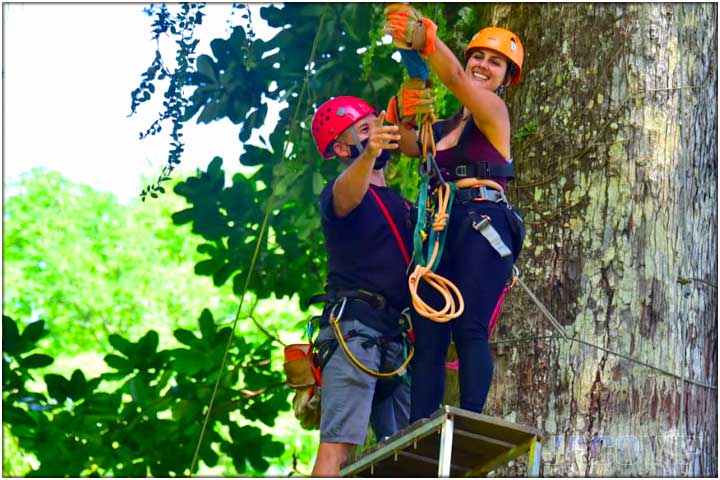 Tour guide and guest on tarzan swing in costa rica