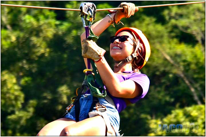 Close up of Pretty girl on zipline in jaco