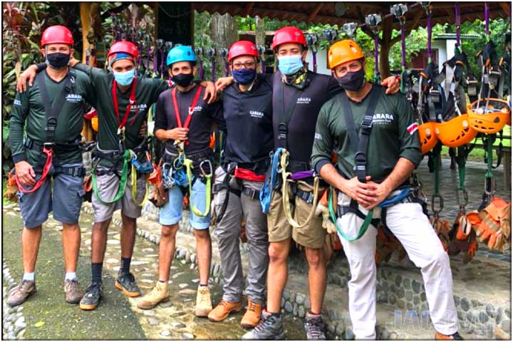 Zip line tour guides with gear