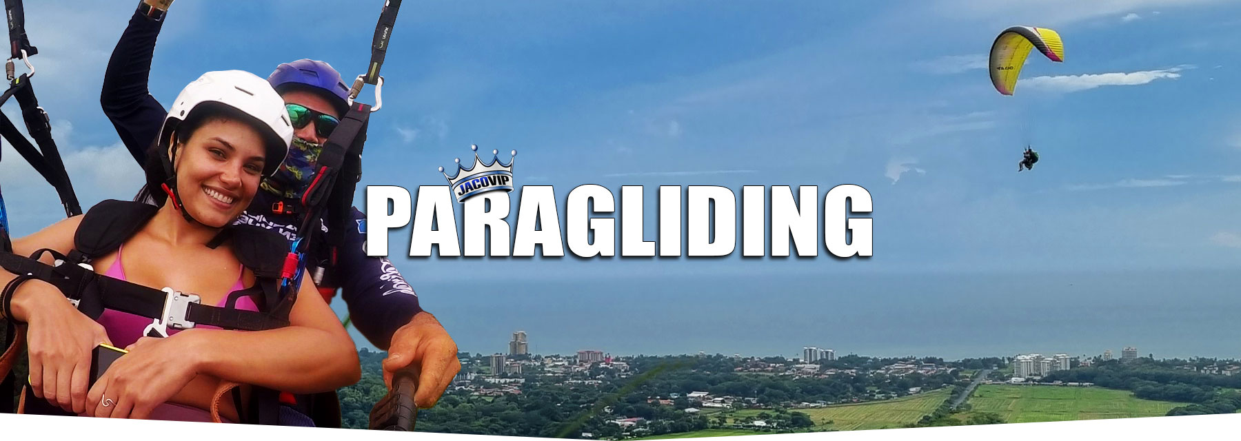 Lady paragliding in Jaco Costa Rica with pilot.