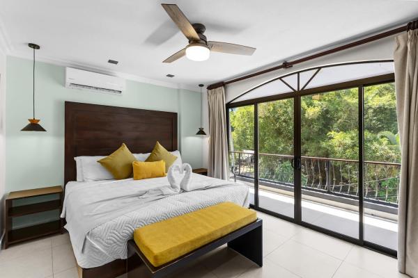 Bedroom five on the third floor with king bed and view