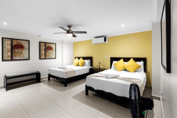Bedroom one on the ground floor with two queen beds
