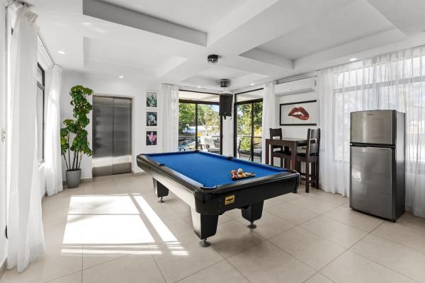 Living area with billiards table at the Jaco Beach villa