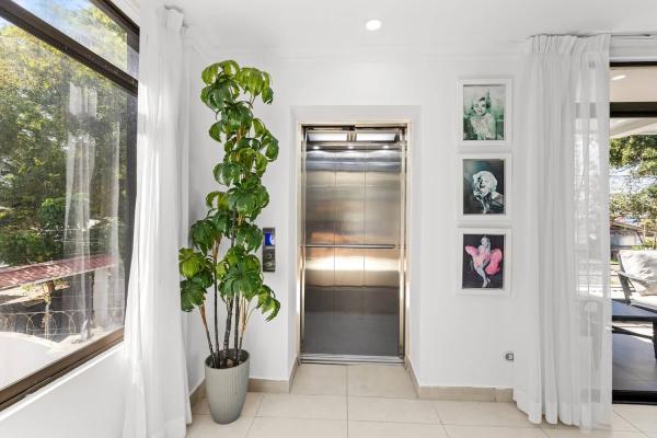Convenient elevator at Pacific Palms multi-floor villa
