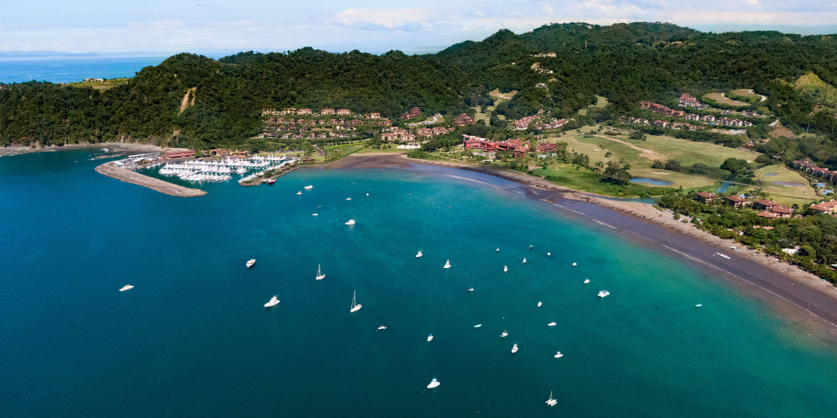 Aerial view of Playa Herradura calm bay with Los Sueños Marina and resort Costa Rica