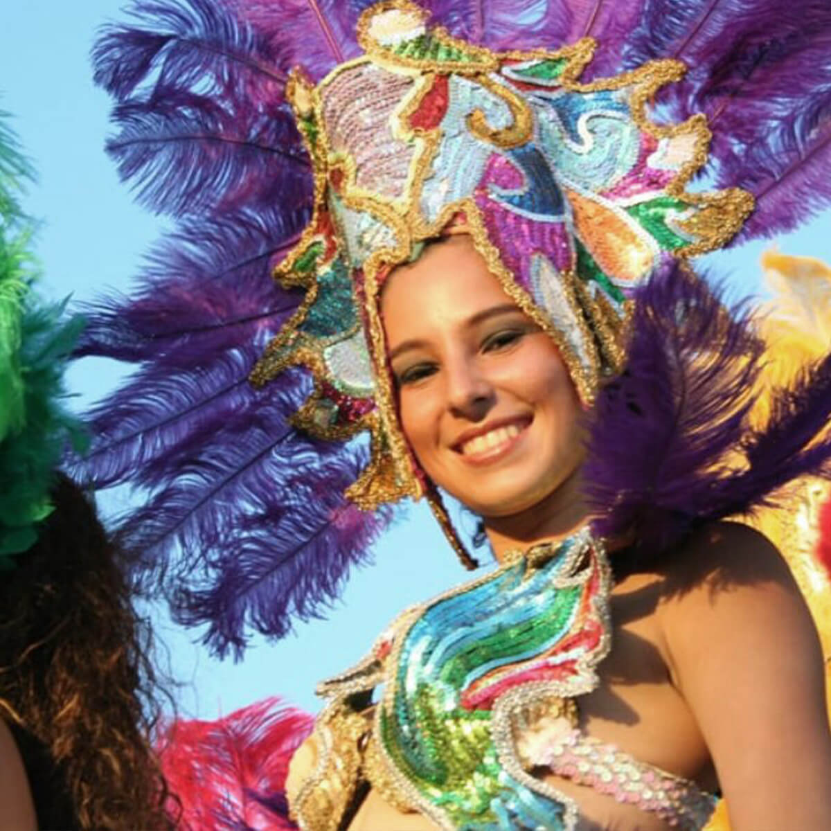 Girl with feathers and costume for Jaco Costa Rica Carnaval Festival