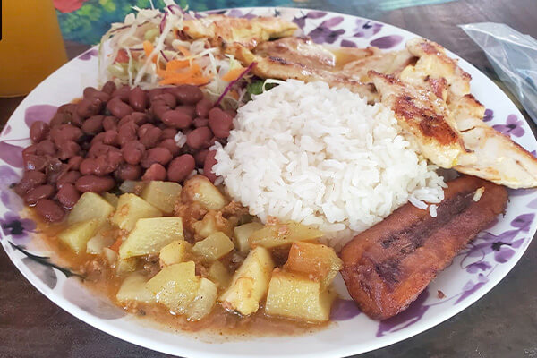 Classic Costa Rica casado dish with rice, beans, chicken and plantain