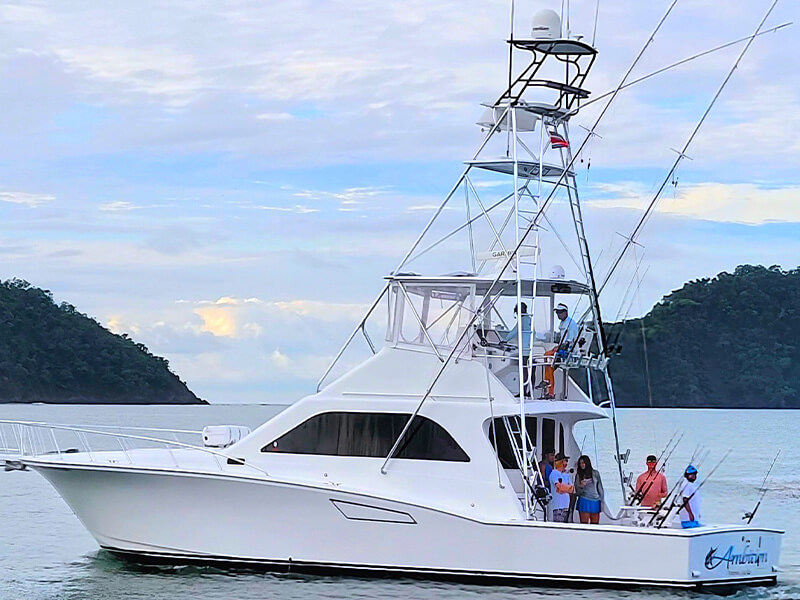 Sport fishing charter boat Ambicion leaving Los Sueños Marina Costa Rica with group on deck