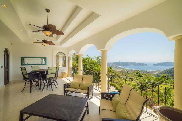 Ocean view balcony with living and dining area at Casa Puesta Del Sol