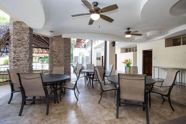 Outdoor dining area with several tables at Rancho de Suenos