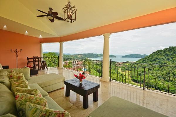 Ocean view balcony with comfortable seating at Casa Solara