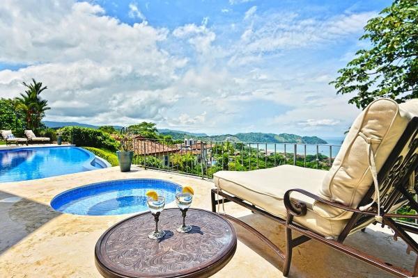 View of a sunbathing chair next to the jacuzzi with ocean view