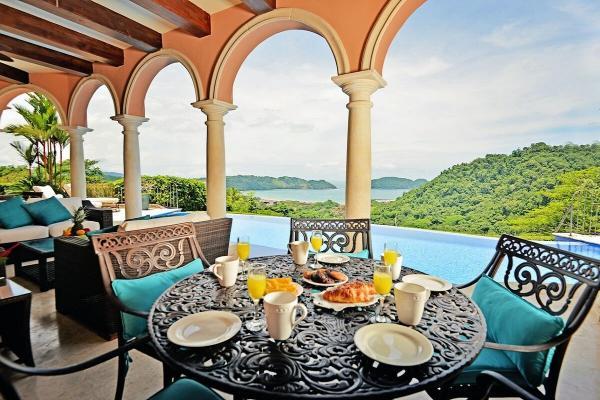 Outdoor side dining table at Casa Solara with ocean view